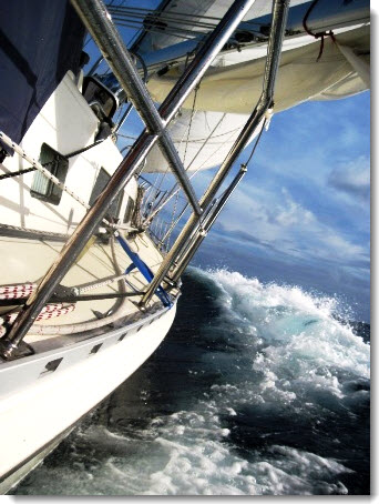Rig storm sails for your specific sailboat. Raise the tack on a short wire or rope pendant for better visibility and to keep the sail clear of boarding seas. &##x28;photo of Rubicon running in a near gale