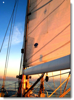 Use clouds or celestial bodies to make steering easier when coastal or offshore sailing. Note the moon &##x28;upper left&##x29; in this photo. Check the compass course often if you steer on these movable objects.