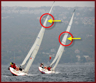 Look at the point where each mainsail begins to twist &##x28;yellow arrow&##x29;. The mainsail to the left has twist too high and this stalls the sail. The mainsail to the right has the proper twist, which begins